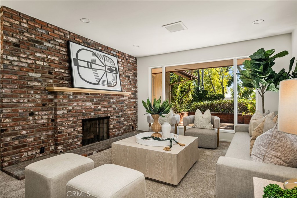 12011 Theta Road North Tustin, CA 92705 - Photo 4 of 49 Wall of glass and brick fireplace in the Living Room