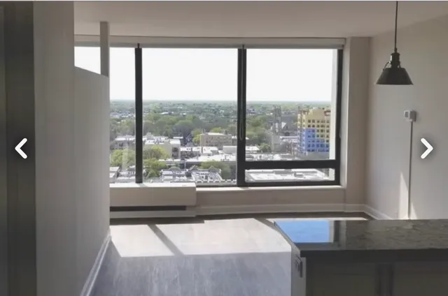 a kitchen with appliances a sink and cabinets