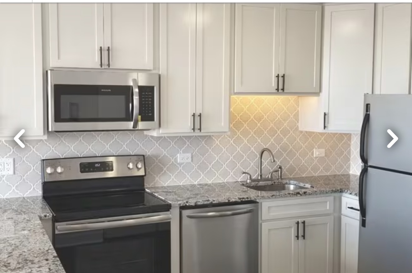 5445 North Sheridan Road, Unit 1805 Chicago, IL 60640 - Photo 4 of 12 a kitchen with appliances a sink and cabinets