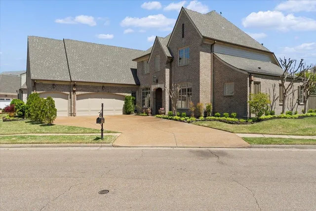 a bathroom with a granite countertop sink and a toilet