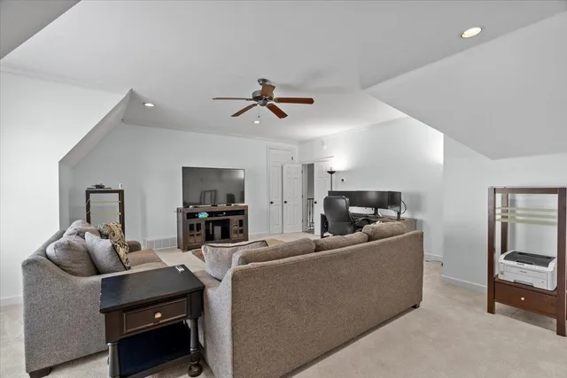 a view of a house with floor to ceiling windows and a basket ball poll