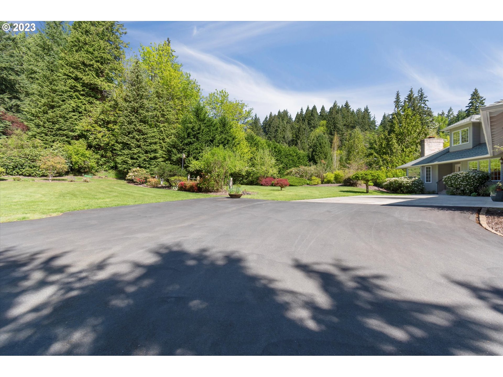 75442 Fern Hill Road Rainier, OR 97048 - Photo 3 of 48 a view of a road with a yard and a car park