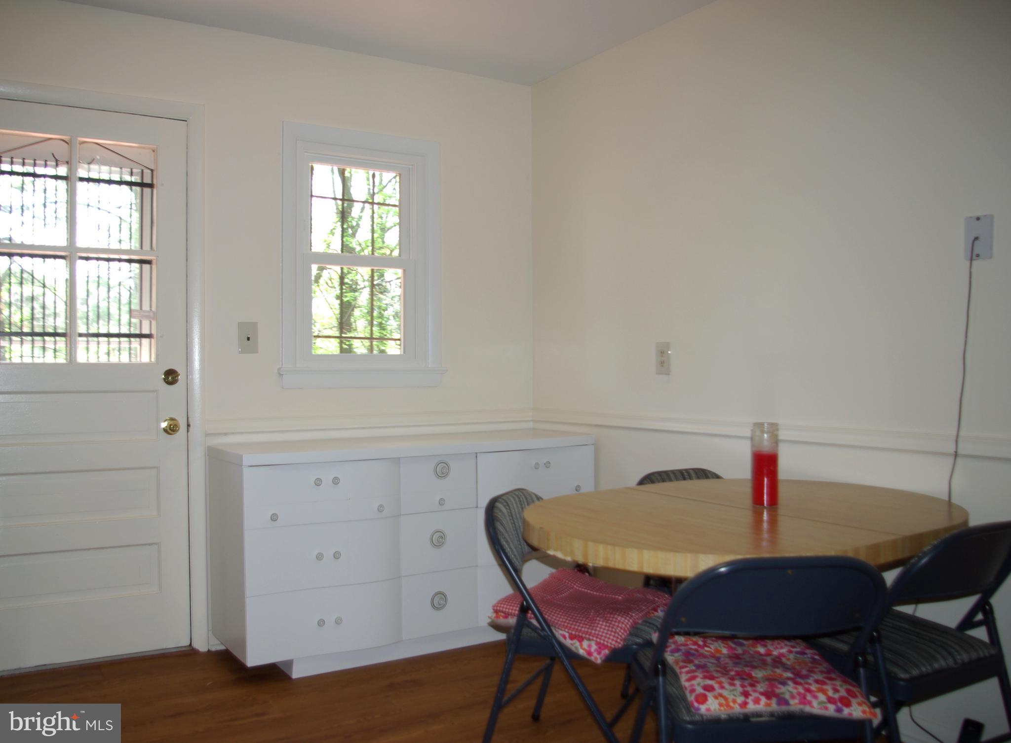 2004 Prichard Road Silver Spring, MD 20902 - Photo 6 of 21 Table space Kitchen area with door to deck