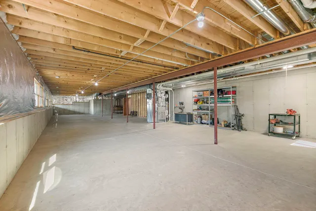 a view of empty room with wooden ceiling