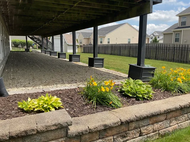a view of a street with a flower garden