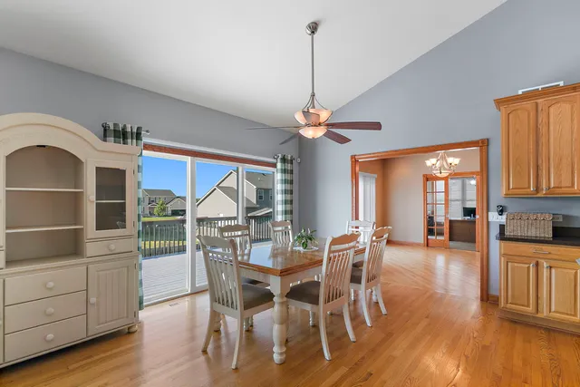 a dining room with furniture window and wooden floor