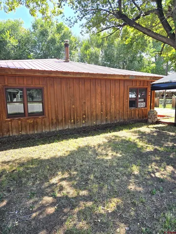 a view of a backyard of the house