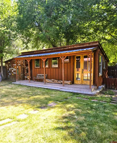 a view of a house with pool and porch