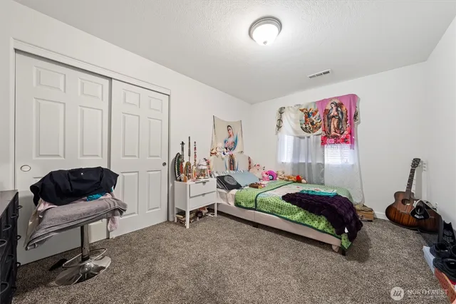 a bedroom with furniture and a bed