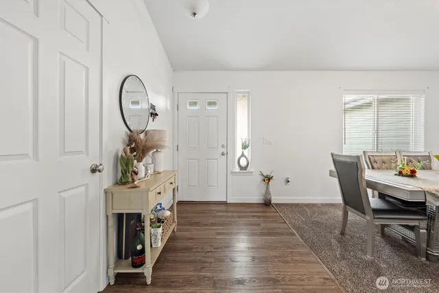 a view of a livingroom with furniture and front door