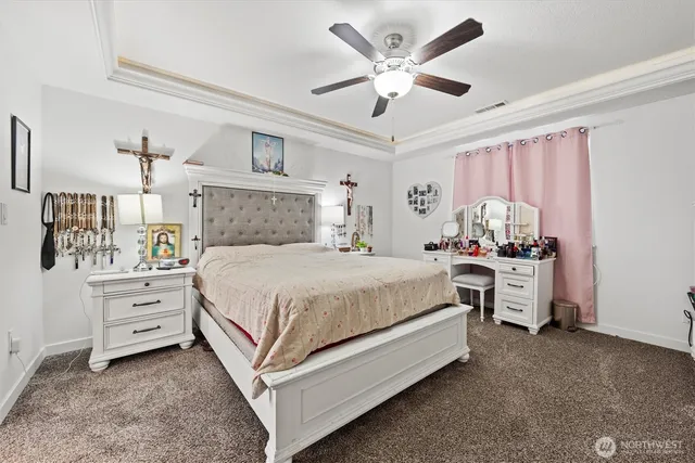 a spacious bedroom with a bed and a window