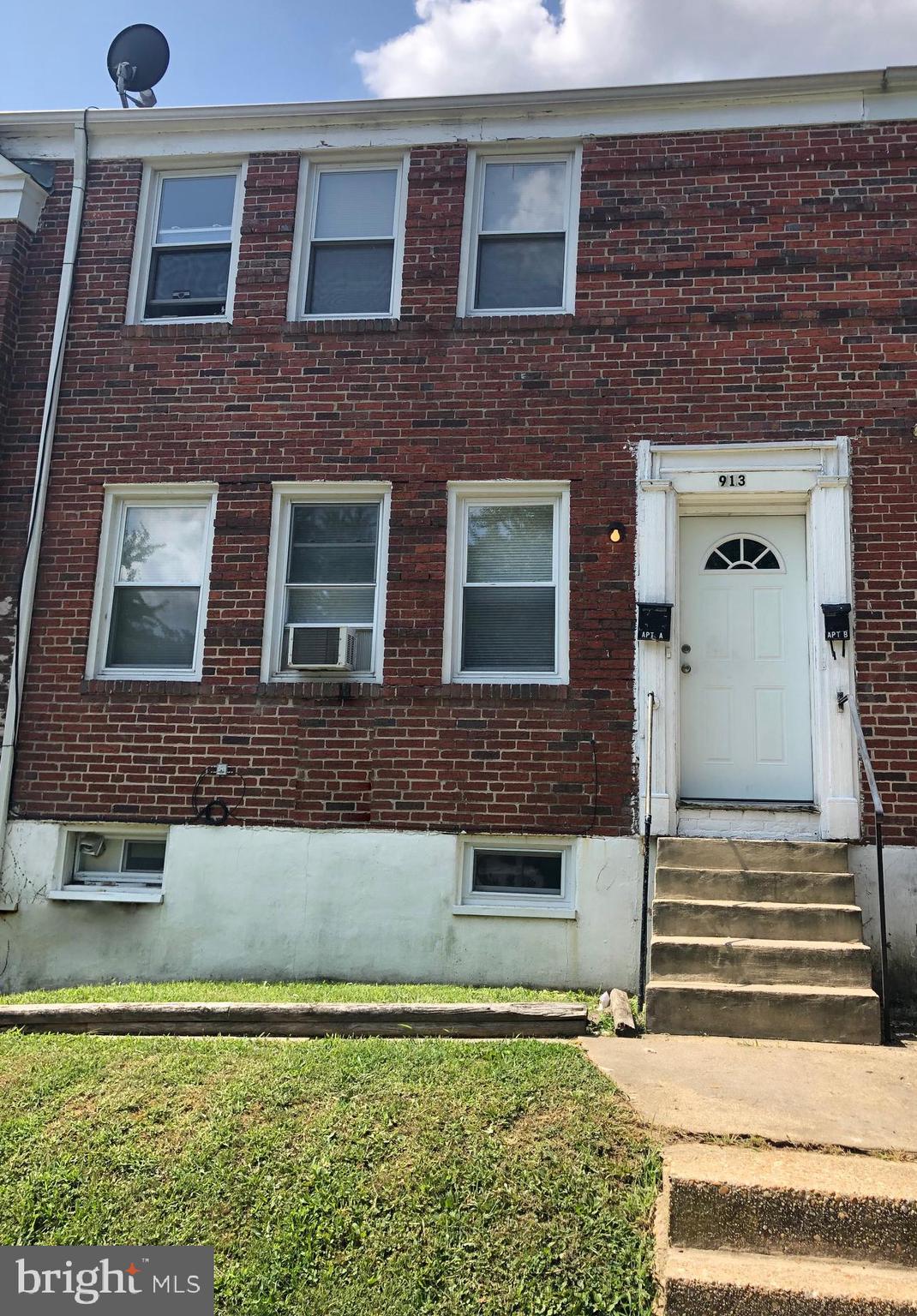 913 St Dunstans Road Baltimore, MD 21212 - Photo 1 of 28 a front view of a house with a yard