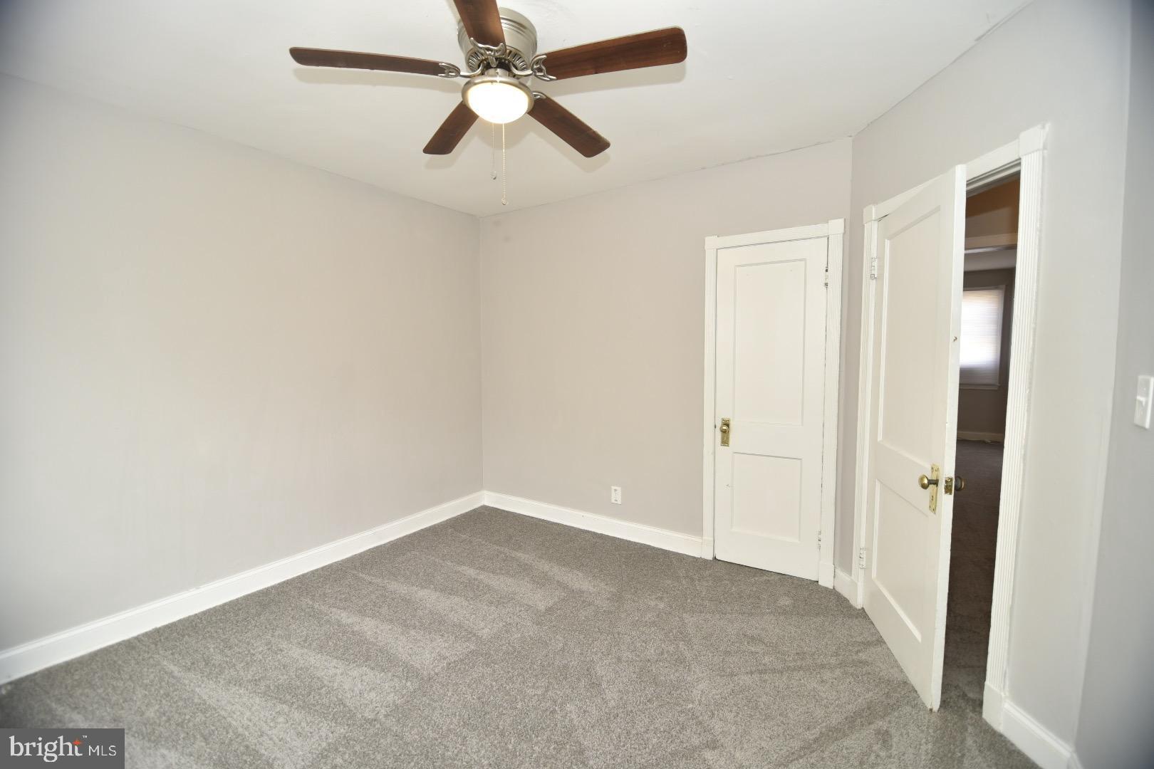 913 St Dunstans Road Baltimore, MD 21212 - Photo 4 of 28 an empty room with closet and a chandelier fan
