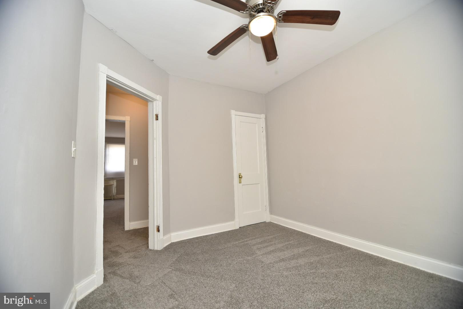 913 St Dunstans Road Baltimore, MD 21212 - Photo 6 of 28 an empty room with closet and a chandelier fan