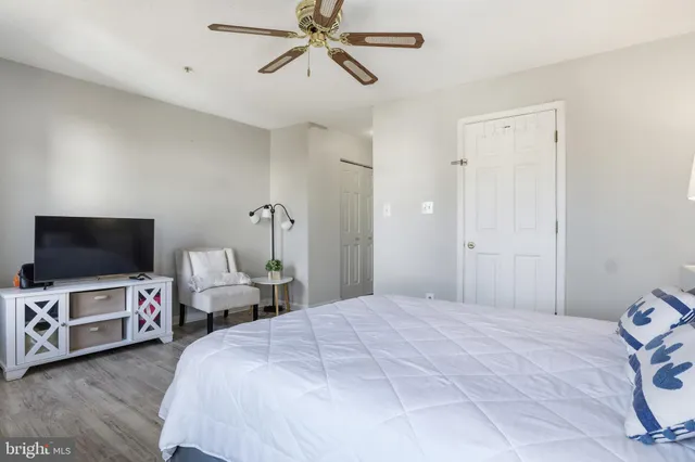 a bedroom with bed and tv