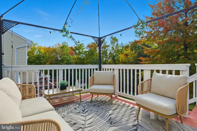 a outdoor space with patio couches and a fireplace
