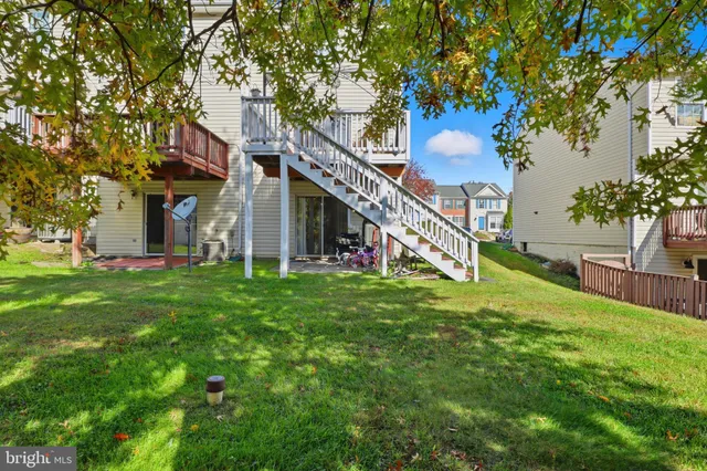 a aerial view of a house with a yard