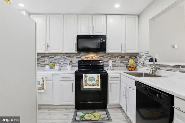 a kitchen with a stove and a sink