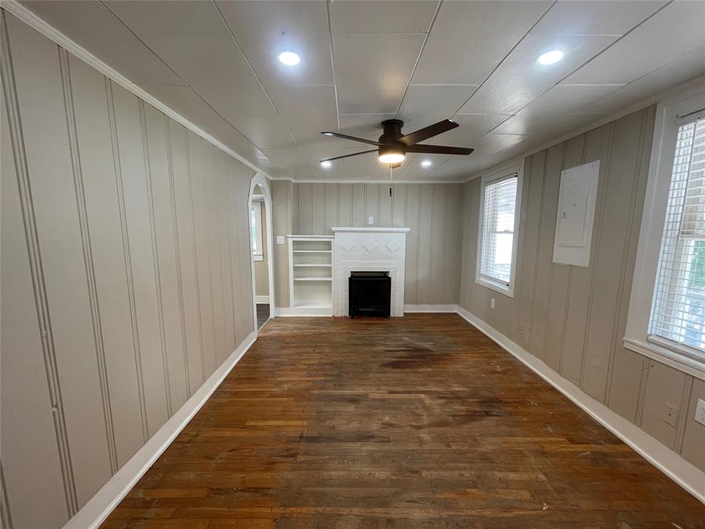 2012 Sanguinet Street Fort Worth, TX 76107 - Photo 1 of 11 an empty room with windows and fireplace