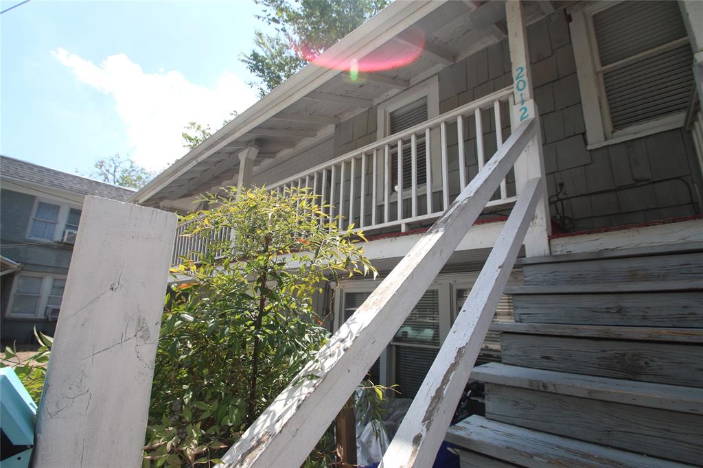 2012 Sanguinet Street Fort Worth, TX 76107 - Photo 11 of 11 a balcony with wooden floor and stairs