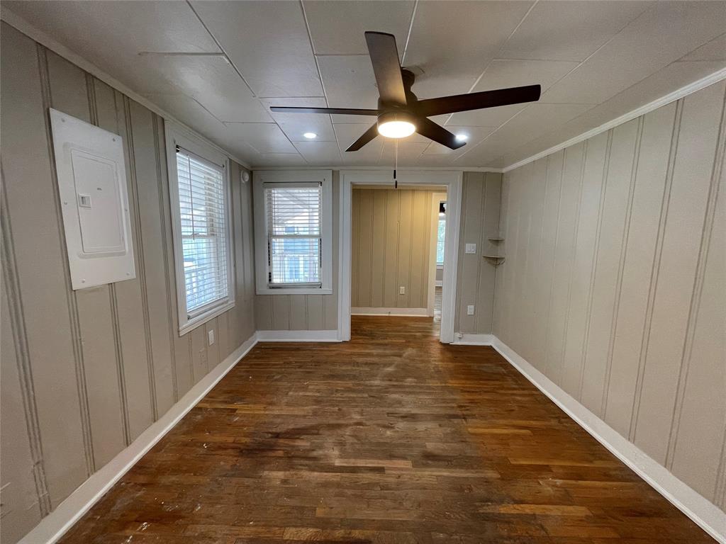 2012 Sanguinet Street Fort Worth, TX 76107 - Photo 4 of 11 wooden floor in an empty room with a window