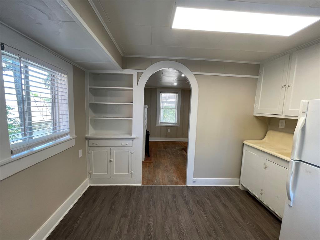 2012 Sanguinet Street Fort Worth, TX 76107 - Photo 6 of 11 a view of empty room with wooden floor and fan
