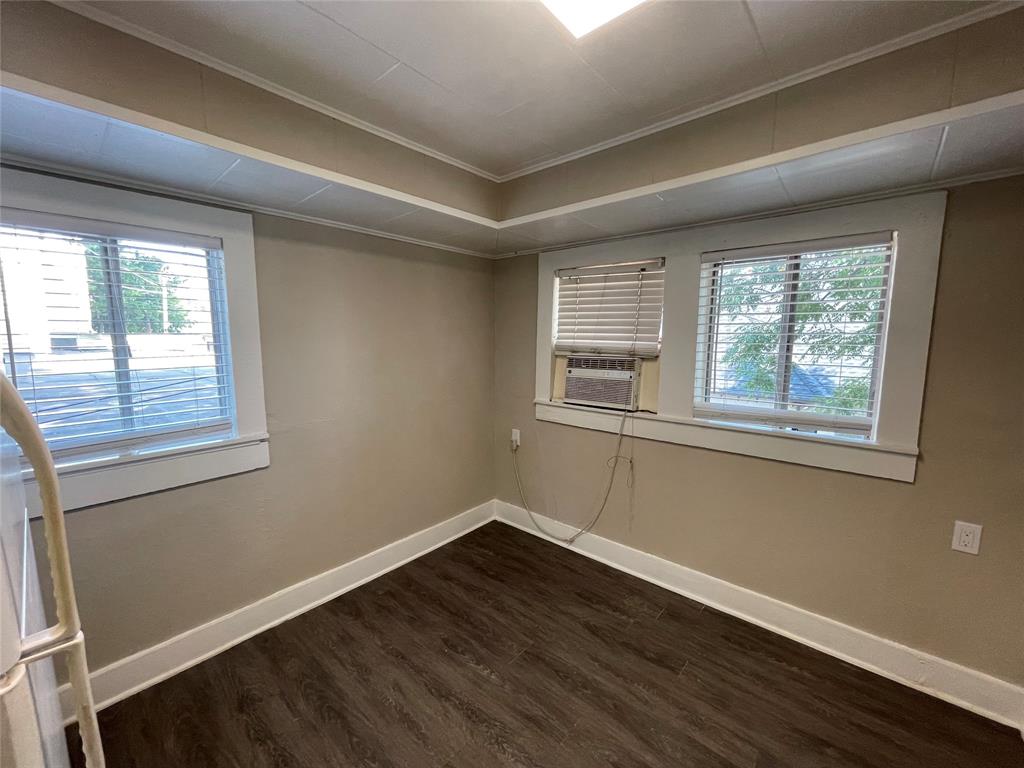 2012 Sanguinet Street Fort Worth, TX 76107 - Photo 7 of 11 a view of a room with wooden floor and windows
