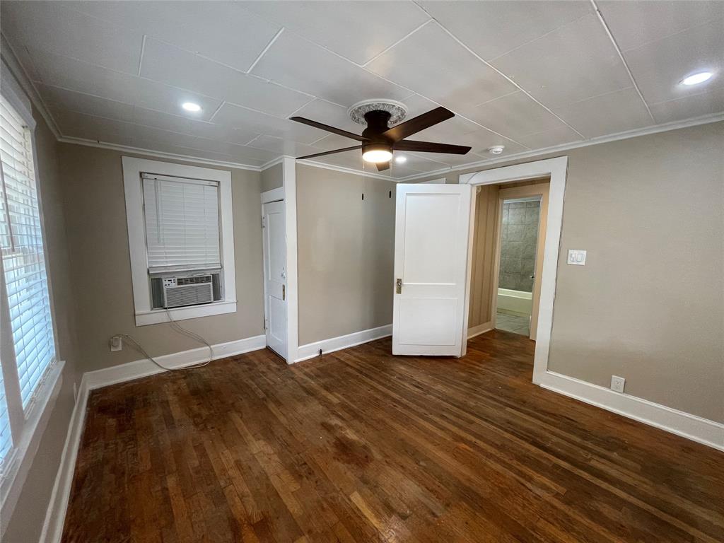 2012 Sanguinet Street Fort Worth, TX 76107 - Photo 10 of 11 wooden floor in an empty room with a window