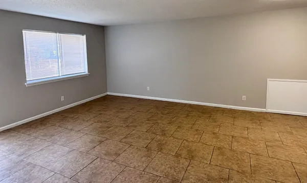 a kitchen with a refrigerator sink and cabinets