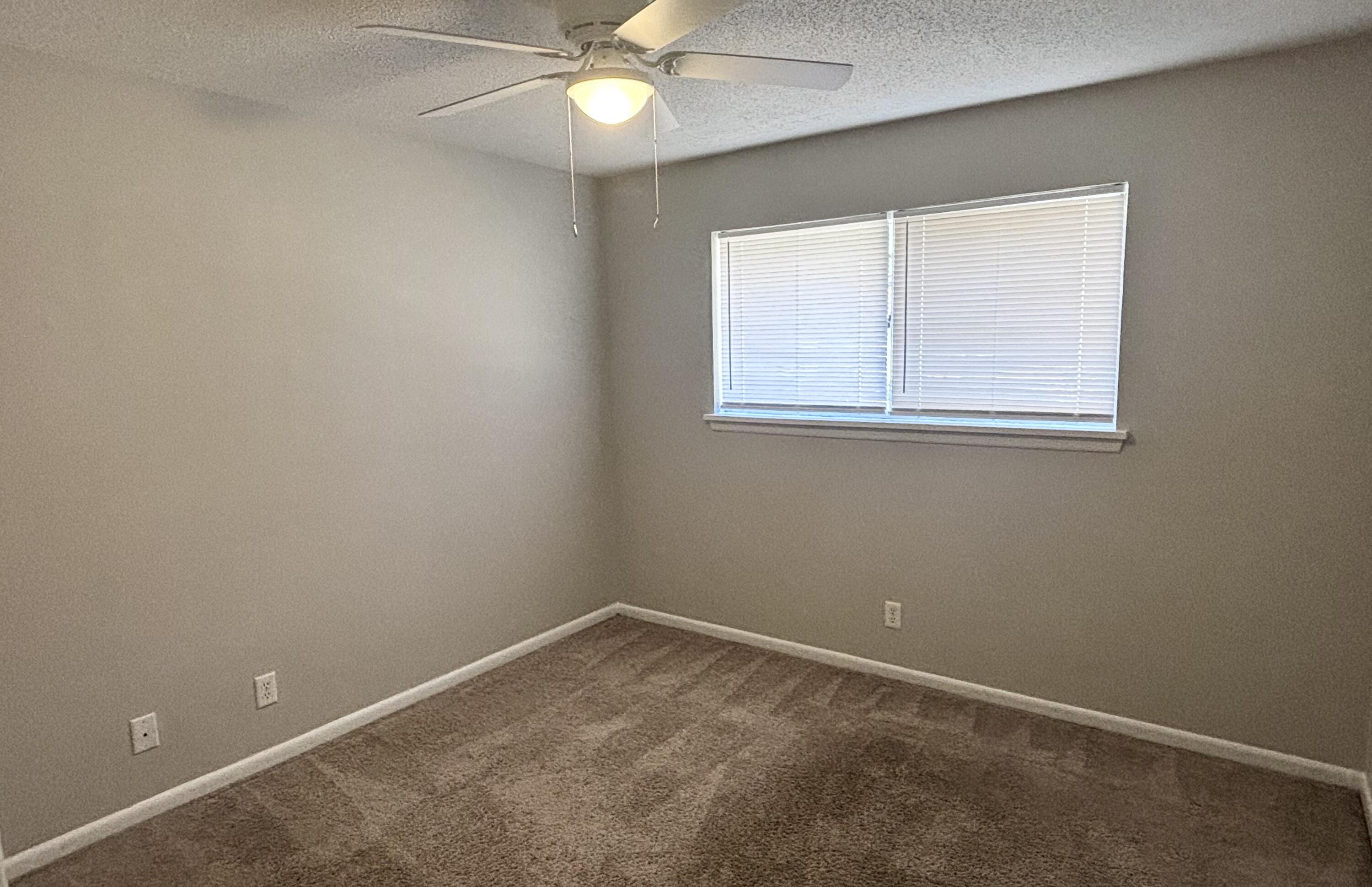 322 Pelham Road, Unit B Fort Walton Beach, FL 32547 - Photo 6 of 10 an empty room with a window