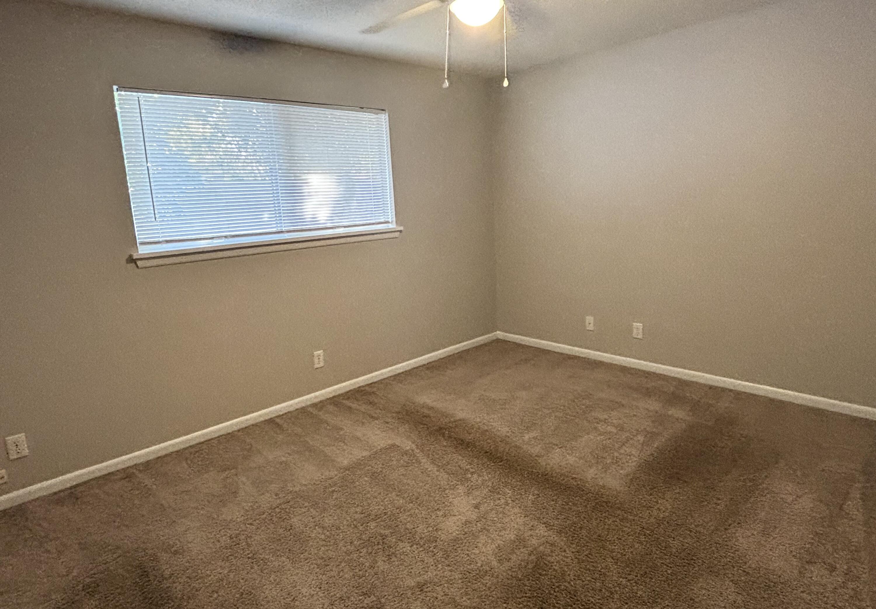 322 Pelham Road, Unit B Fort Walton Beach, FL 32547 - Photo 7 of 10 an empty room with a window