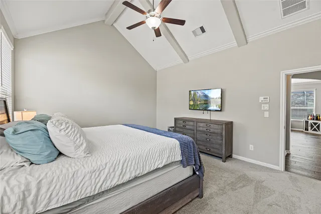 a bedroom with a bed and a table