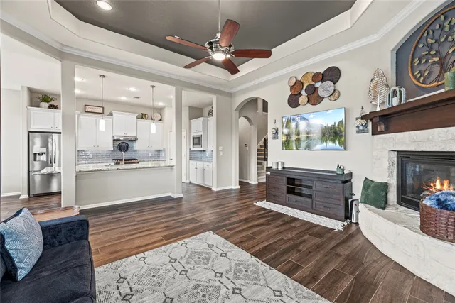a living room with furniture and fireplace