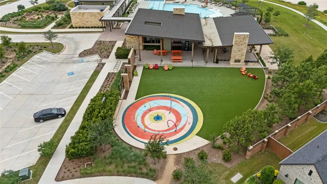 an aerial view of a house with a swimming pool
