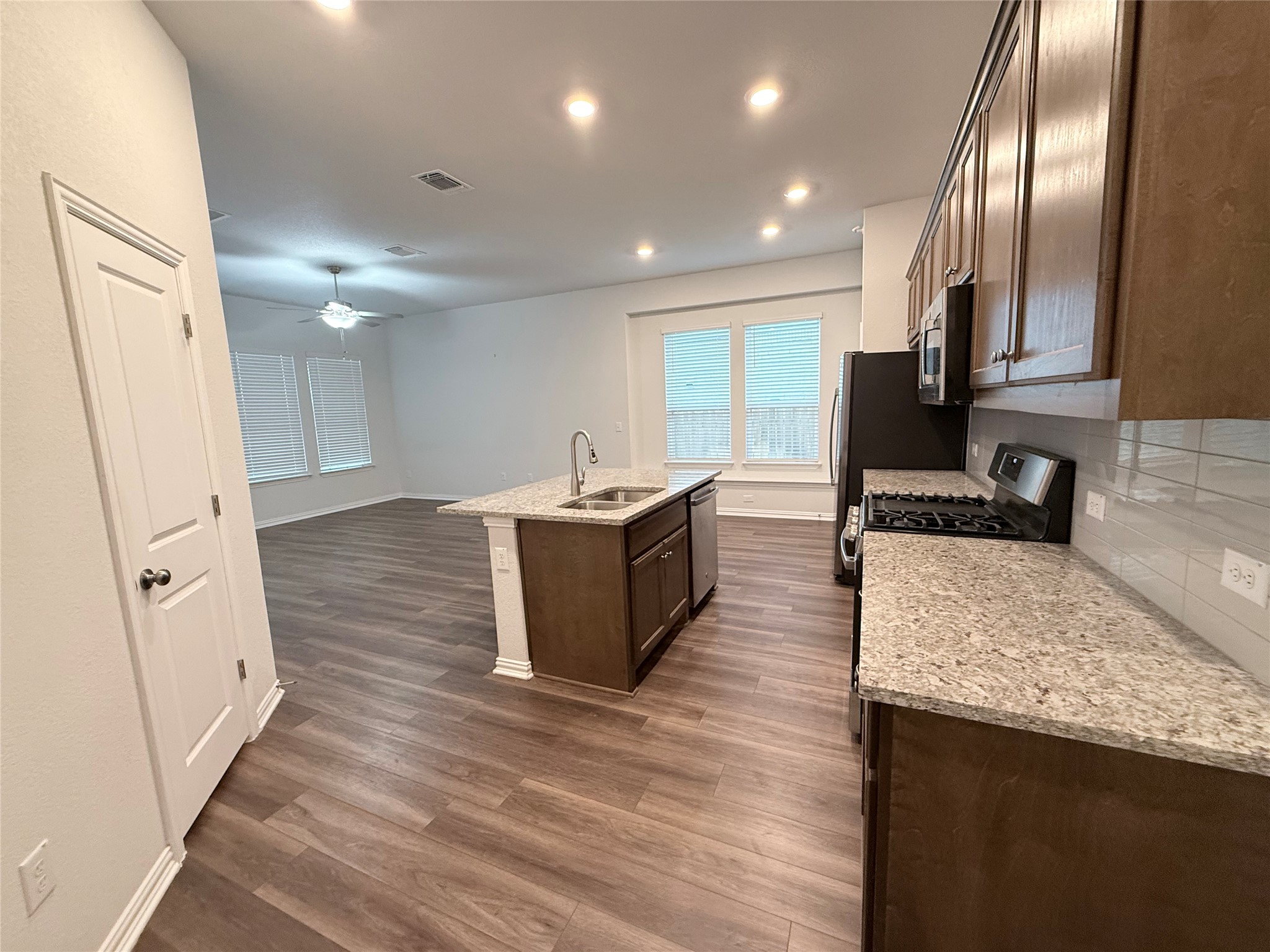 4516 Sea Salt Drive Austin, TX 78747 - Photo 3 of 14 The kitchen greets you as you enter the living area ~ this home has plenty of natural light
