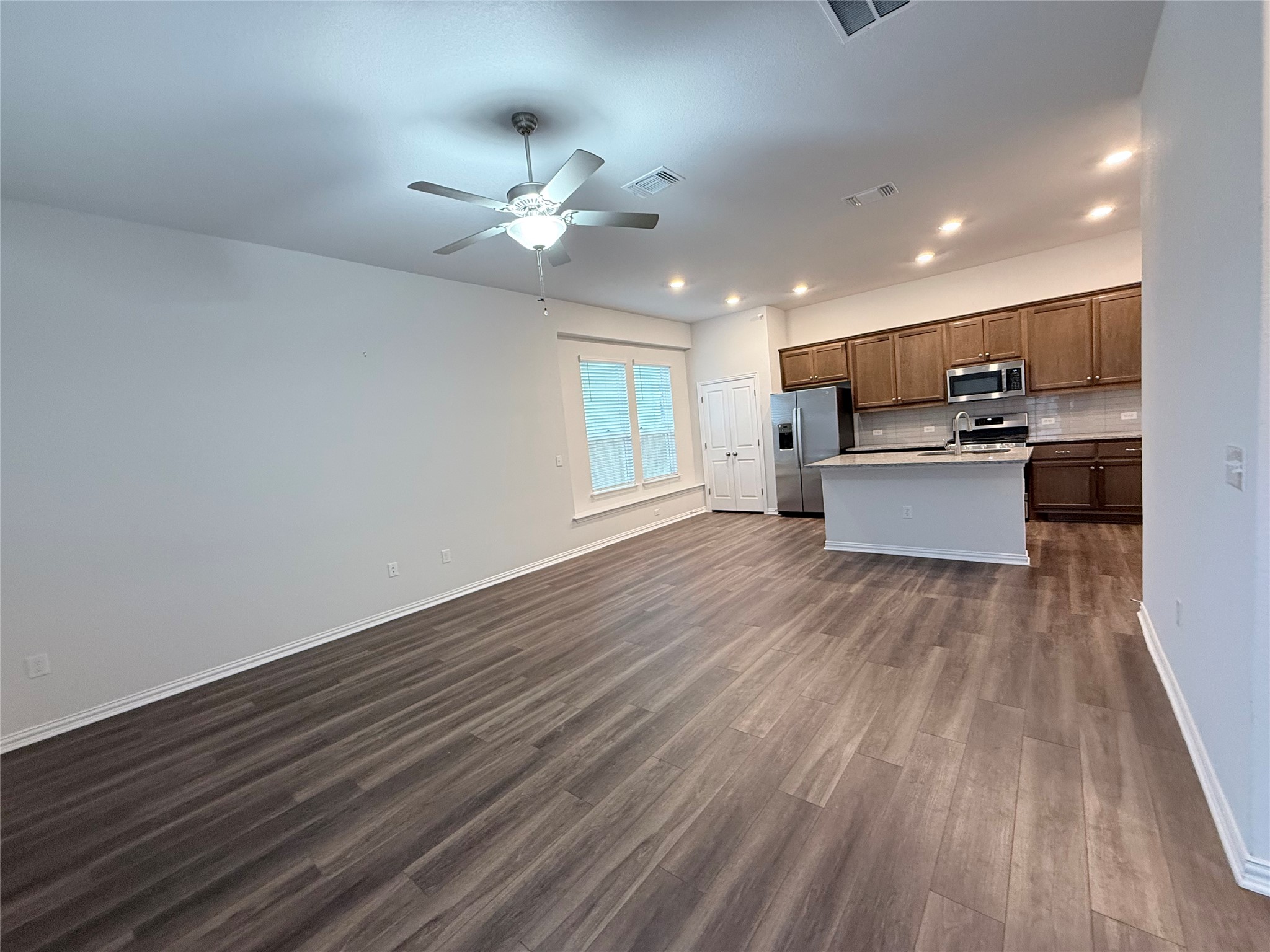4516 Sea Salt Drive Austin, TX 78747 - Photo 14 of 14 Kitchen with open floor plan and island ~ Refrigerator included
