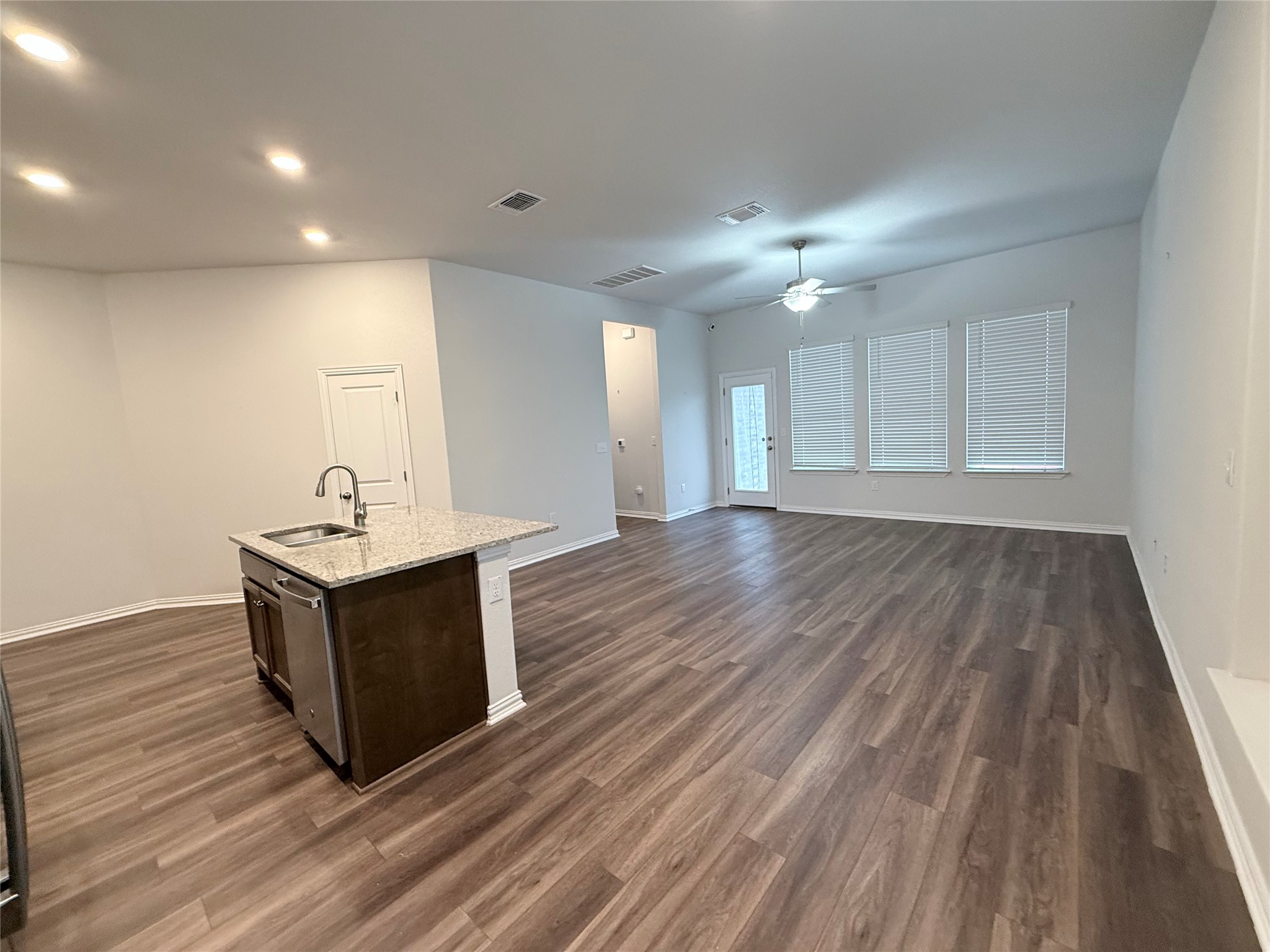 4516 Sea Salt Drive Austin, TX 78747 - Photo 4 of 14 Spacious living area with wall of windows overlooking the back yard