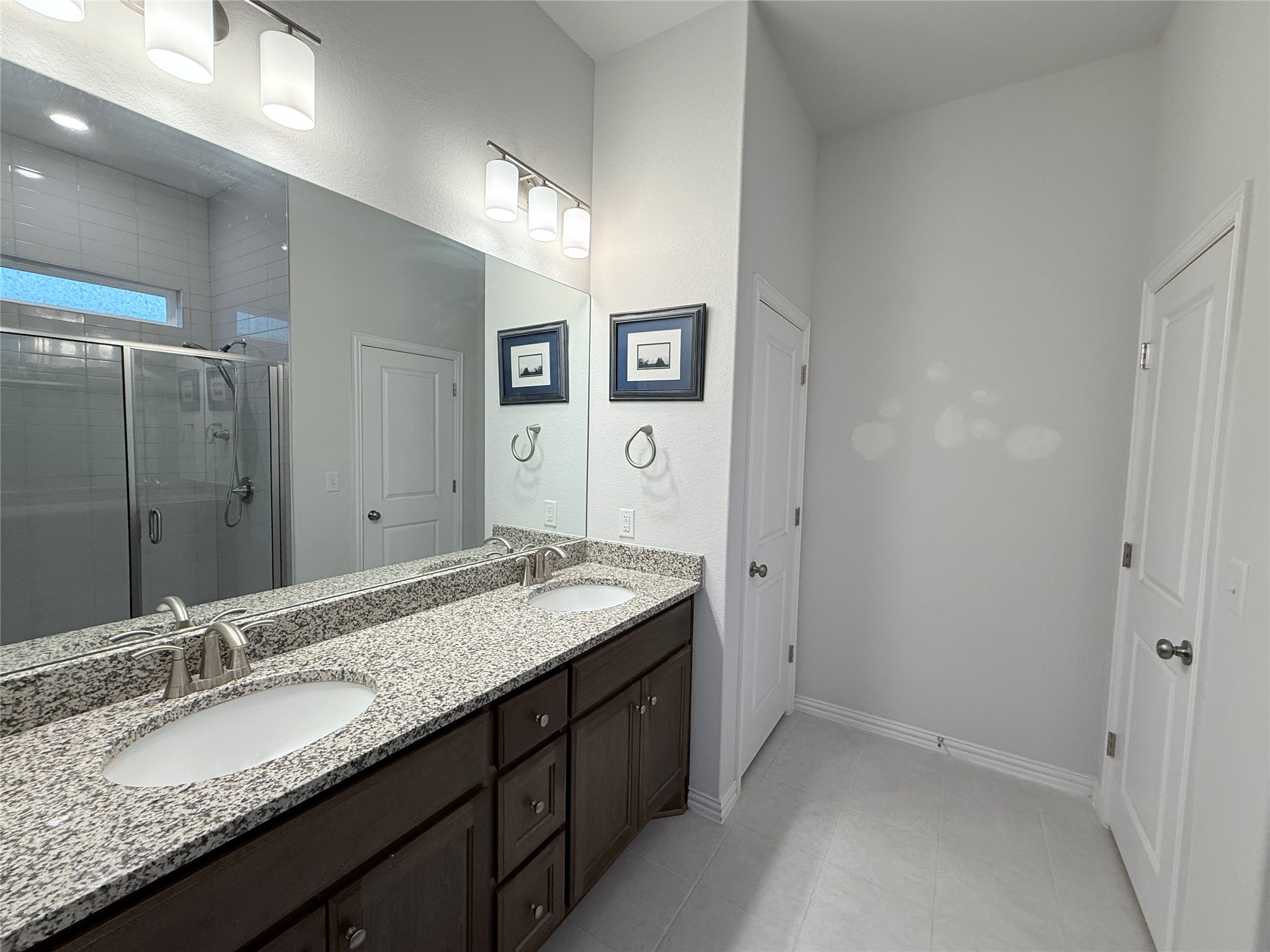 4516 Sea Salt Drive Austin, TX 78747 - Photo 6 of 14 The main bathroom is large and comfortable with its large sink area and linen closet