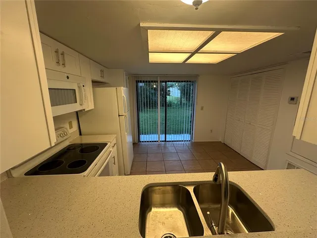 a view of a kitchen with a sink and dishwasher