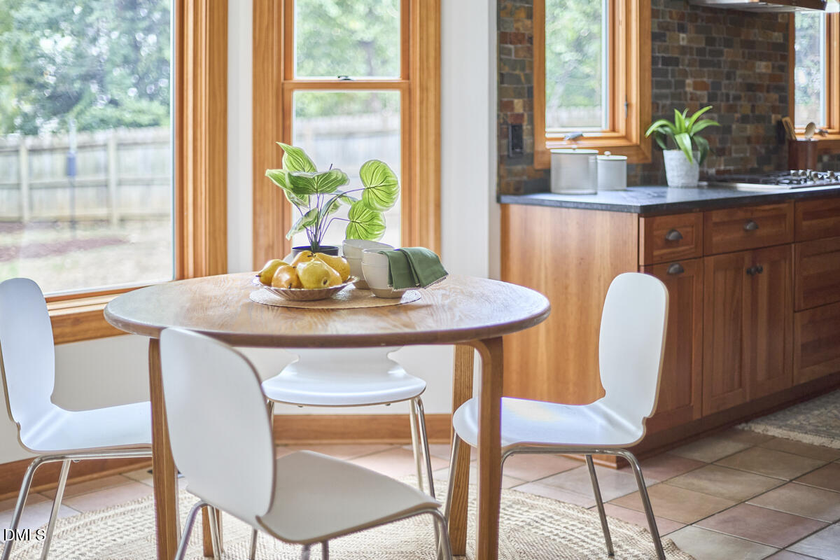 8109 Olde Hill Court Raleigh, NC 27615 - Photo 21 of 65 a dining room with furniture and window