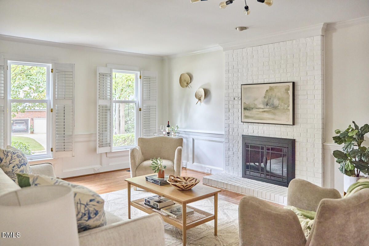 8109 Olde Hill Court Raleigh, NC 27615 - Photo 23 of 65 a living room with furniture and a fireplace