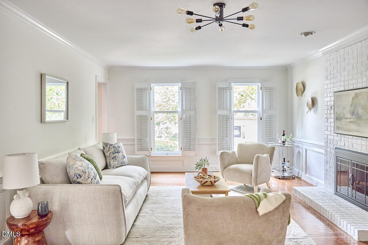 8109 Olde Hill Court Raleigh, NC 27615 - Photo 24 of 65 a living room with furniture and a large window