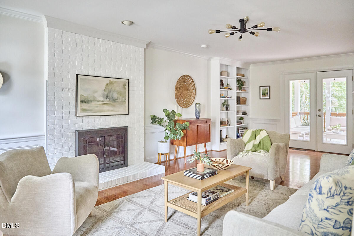 8109 Olde Hill Court Raleigh, NC 27615 - Photo 29 of 65 a living room with furniture and a fireplace
