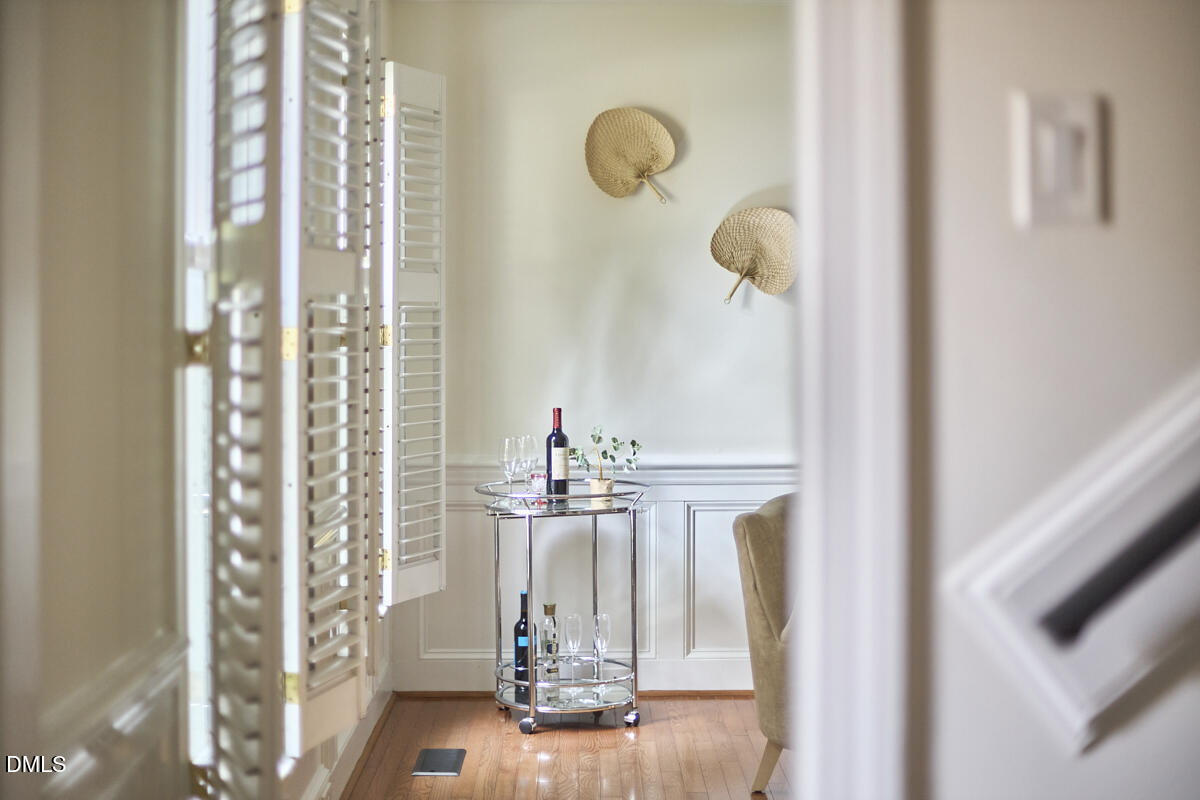 8109 Olde Hill Court Raleigh, NC 27615 - Photo 33 of 65 a view of a dining room with floor to ceiling windows and painted walls
