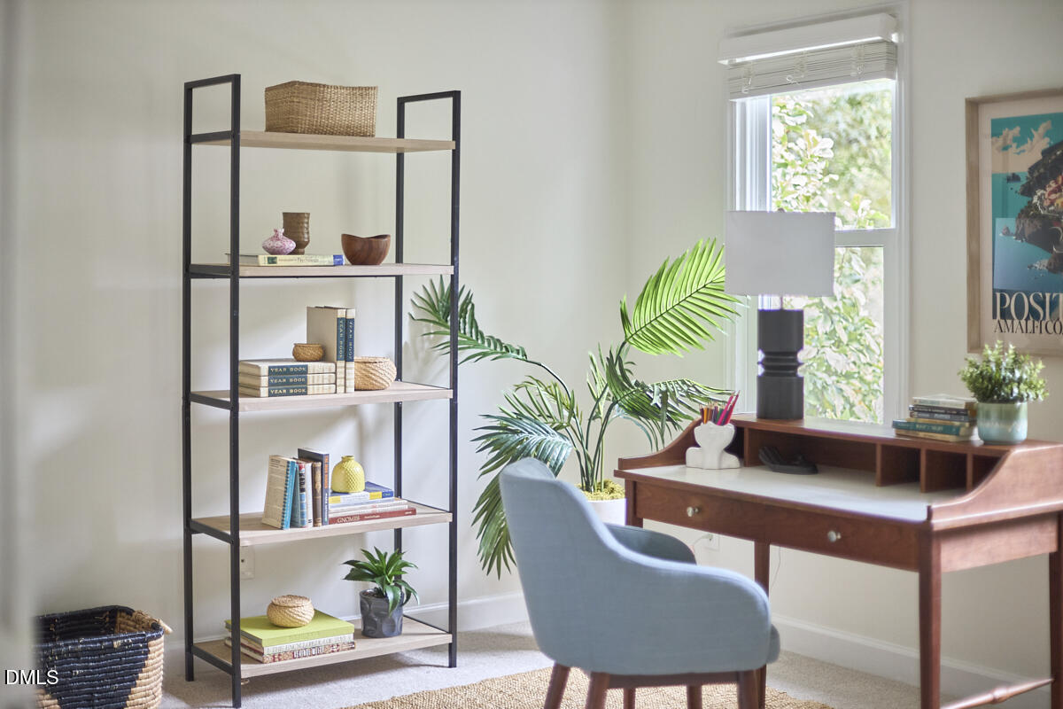 8109 Olde Hill Court Raleigh, NC 27615 - Photo 45 of 65 a living room with furniture and a potted plant