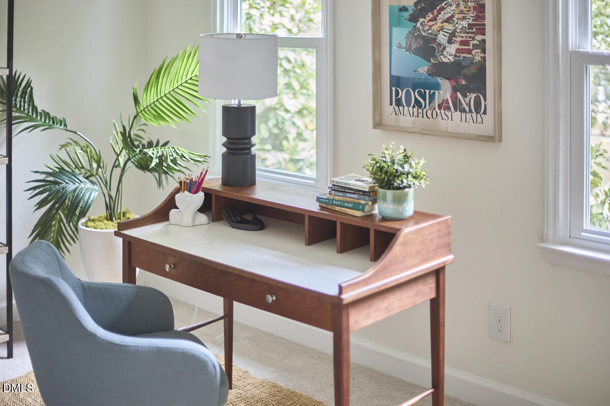 8109 Olde Hill Court Raleigh, NC 27615 - Photo 46 of 65 a room with furniture and a potted plant