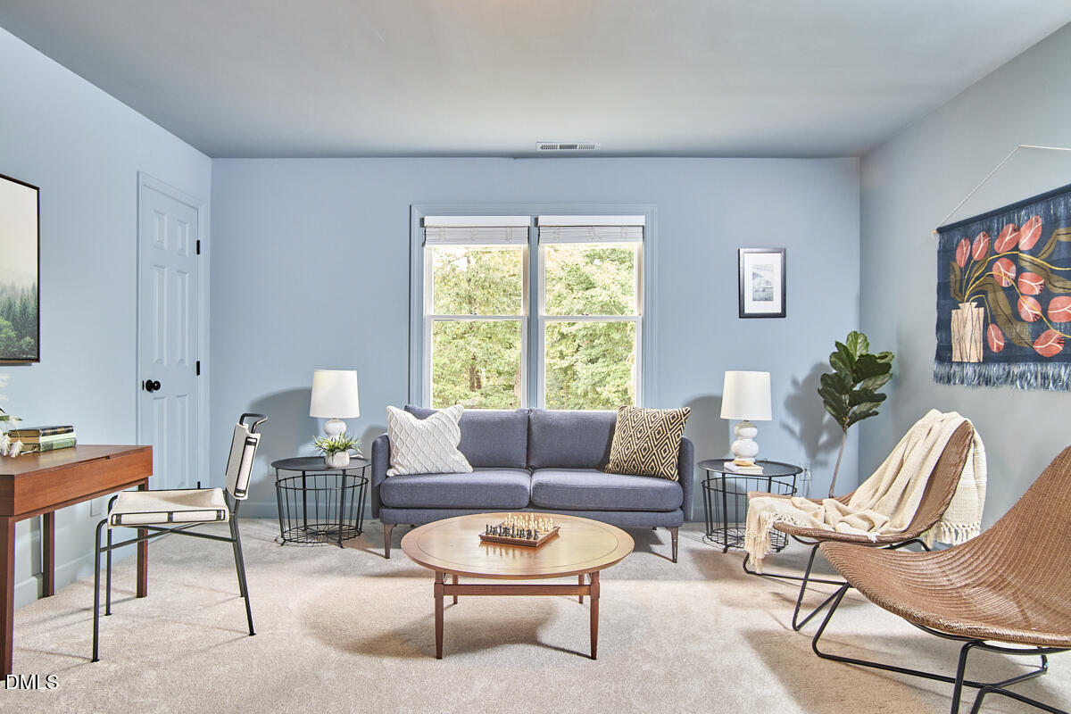 8109 Olde Hill Court Raleigh, NC 27615 - Photo 50 of 65 a living room with furniture and a window