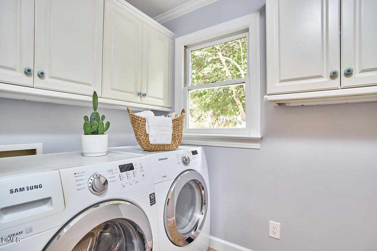 8109 Olde Hill Court Raleigh, NC 27615 - Photo 57 of 65 a utility room with dryer and washer