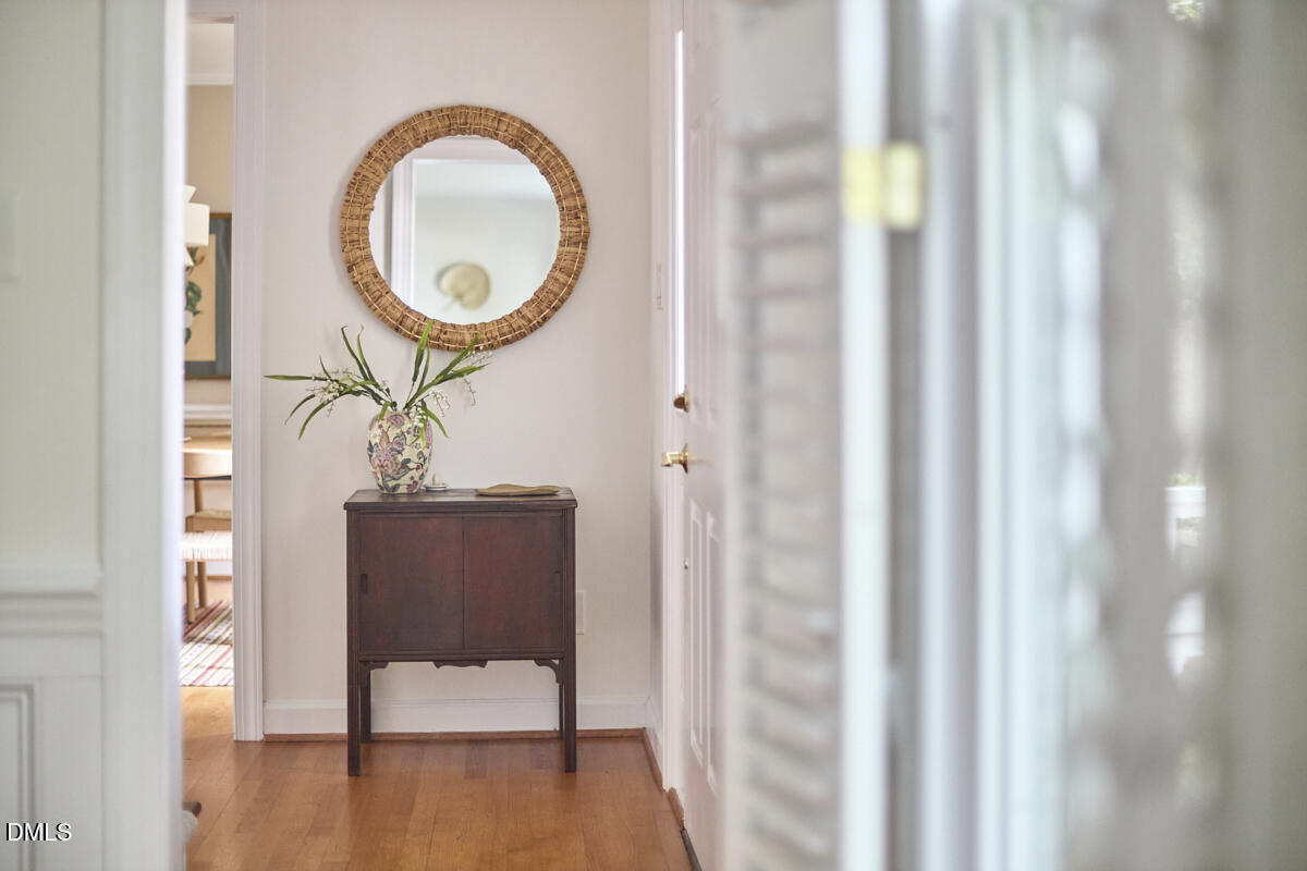 8109 Olde Hill Court Raleigh, NC 27615 - Photo 8 of 65 a living room with furniture and a mirror