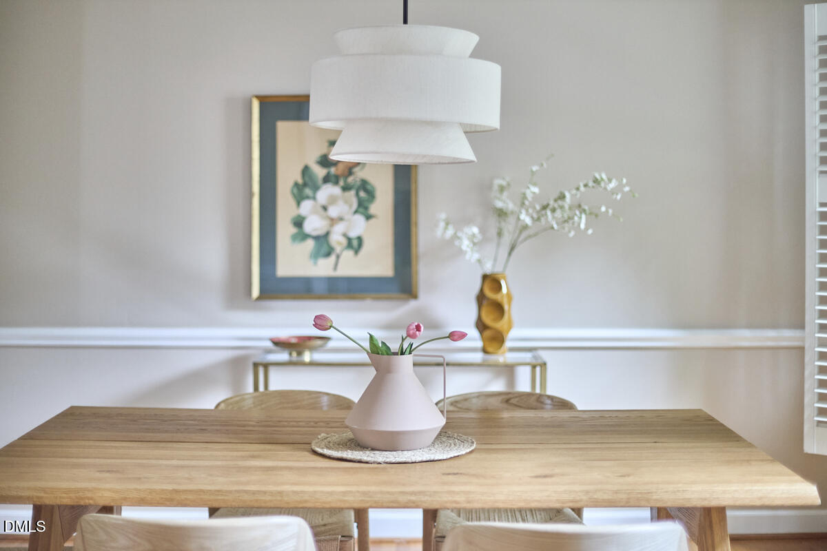 8109 Olde Hill Court Raleigh, NC 27615 - Photo 10 of 65 a cabinet with a vase of flowers on it